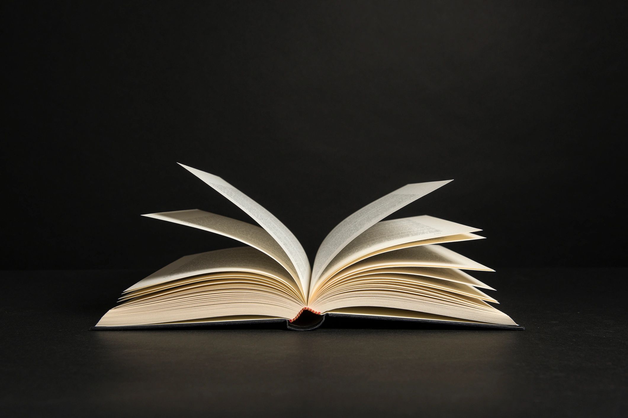 Open book against a dark background