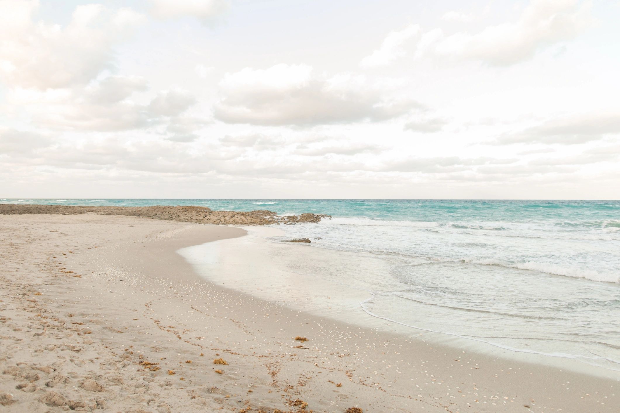Waves splashing along a rocky shoreline in Florida